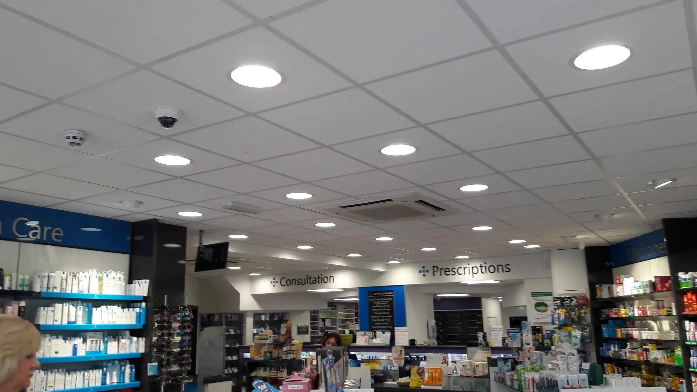 Suspended ceiling with recessed lighting in a pharmacy by CMD Ceilings Ltd Hertfordshire