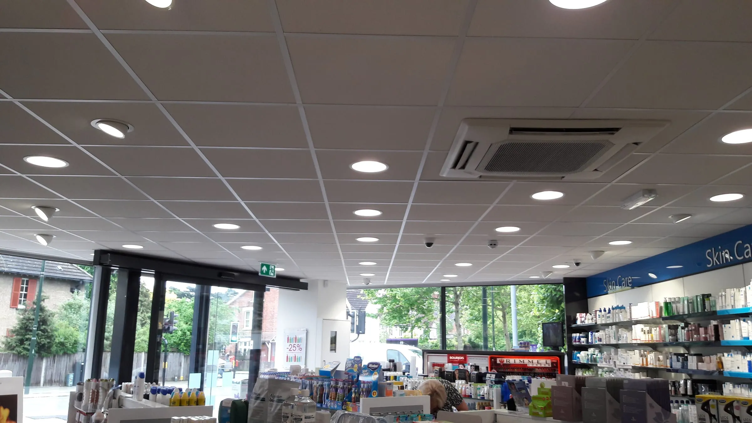 Suspended ceiling with recessed downlights in a pharmacy by CMD Ceilings Ltd Hertfordshire