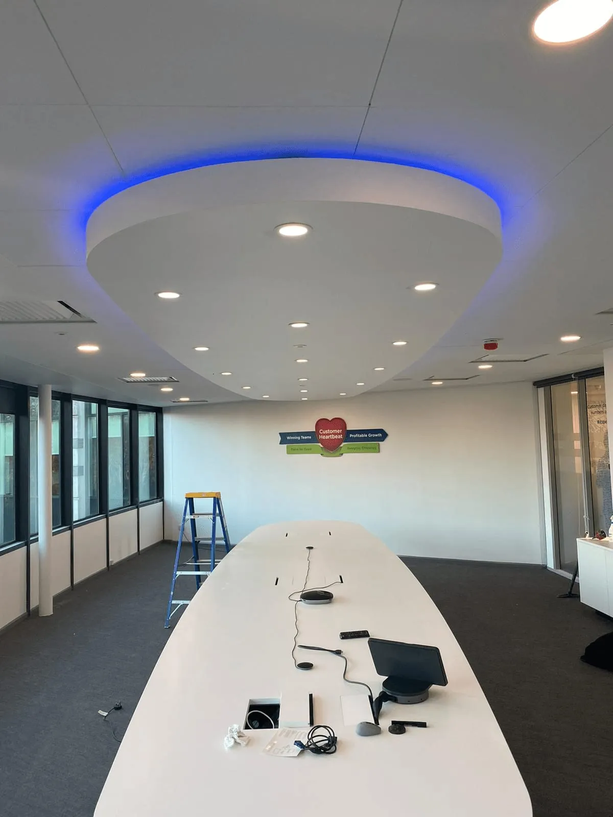 Meeting room with a new suspended ceiling and lighting by CMD Ceilings Ltd
